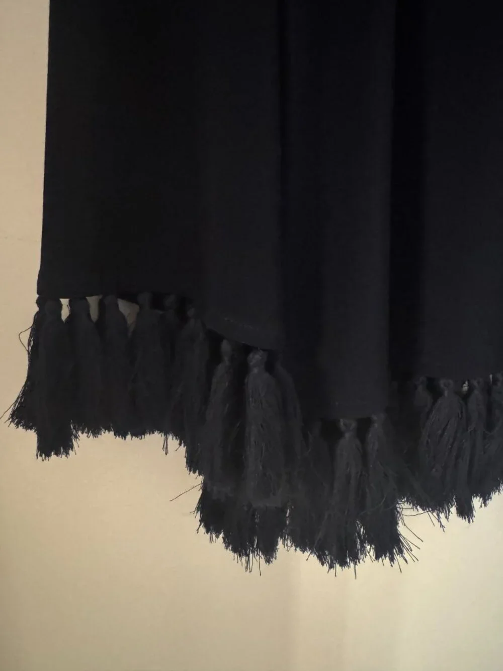 Joseph Ribkoff silky top size M with distinctive fringe along cuffs and hem